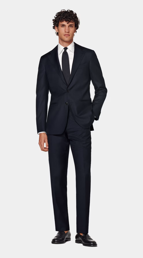 how to look dapper for $1000 man in a navy suit from suitsupply 